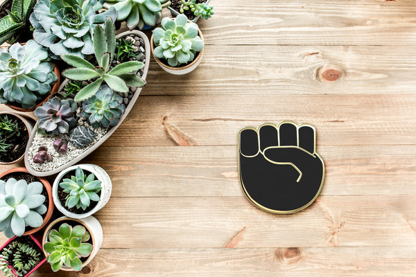 Raised Fist Emoji – Black & Gold Enamel Pin ✊🏿